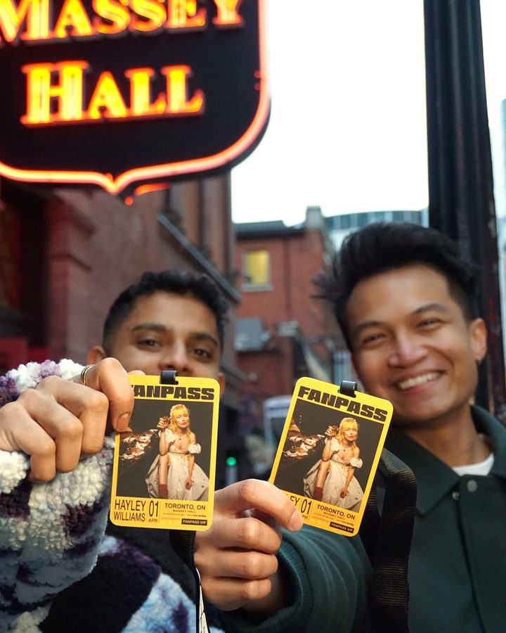 Fanpass members with their passes outside Massey Hall